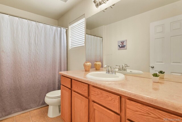 297 N Coolidge Way, Aurora, CO 80018 - bathroom featuring toilet, vanity, and tile patterned floors