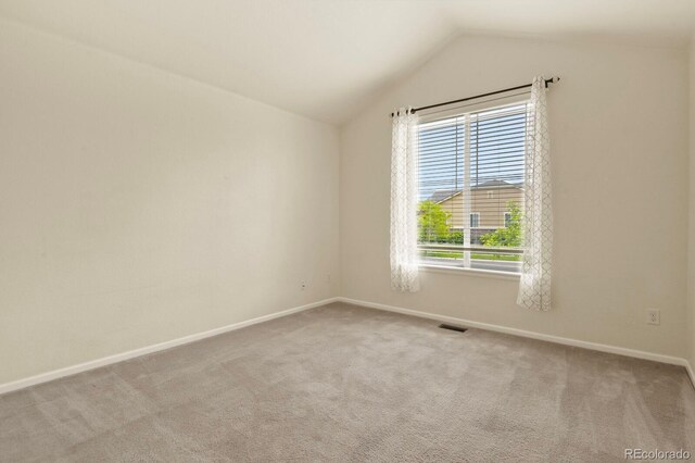 297 N Coolidge Way, Aurora, CO 80018 - unfurnished room with carpet, vaulted ceiling, and baseboards