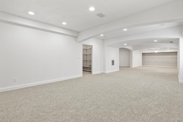 297 N Coolidge Way, Aurora, CO 80018 - below grade area with recessed lighting, arched walkways, carpet floors, and baseboards