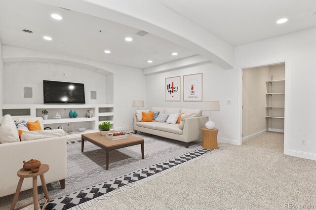 297 N Coolidge Way, Aurora, CO 80018 - carpeted living area featuring recessed lighting, baseboards, and built in features
