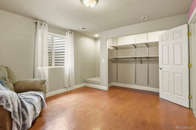 297 N Coolidge Way, Aurora, CO 80018 - living area with light wood-type flooring and baseboards