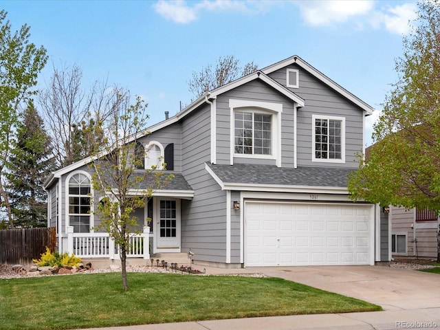 traditional-style home with an attached garage, a porch, driveway, and roof with shingles