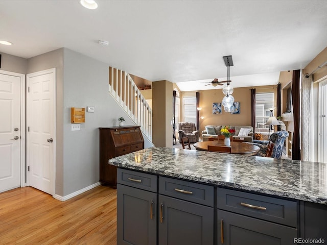 kitchen featuring light wood-style floors, baseboards, plenty of natural light, ceiling fan, and recessed lighting