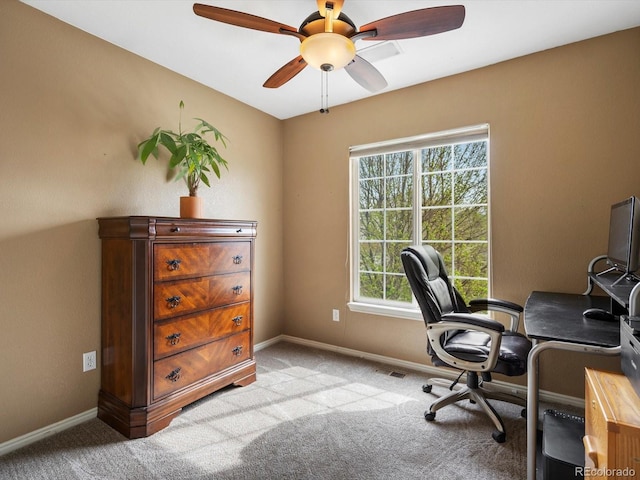 office featuring carpet floors, ceiling fan, and baseboards