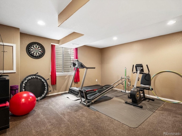workout room featuring recessed lighting and baseboards