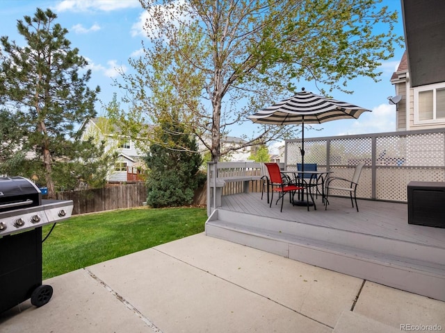 view of patio with outdoor dining space, a wooden deck, and a grill