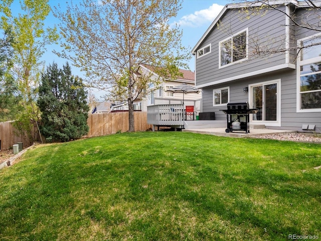 view of yard with a wooden deck