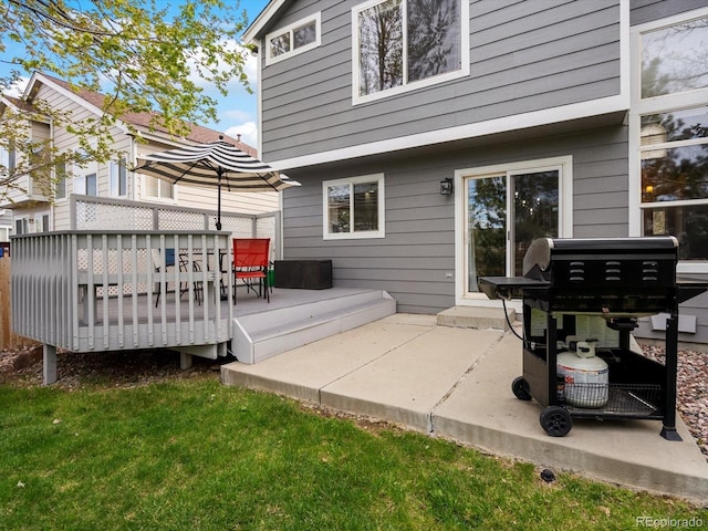 rear view of property with a wooden deck