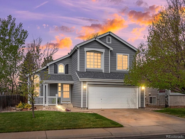 view of front of property featuring a garage, a porch, driveway, and a shingled roof