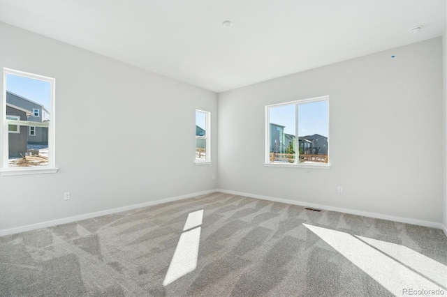 empty room featuring carpet flooring