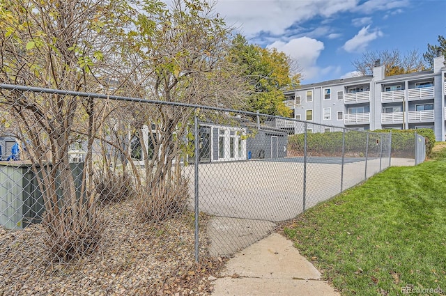 view of gate featuring a lawn