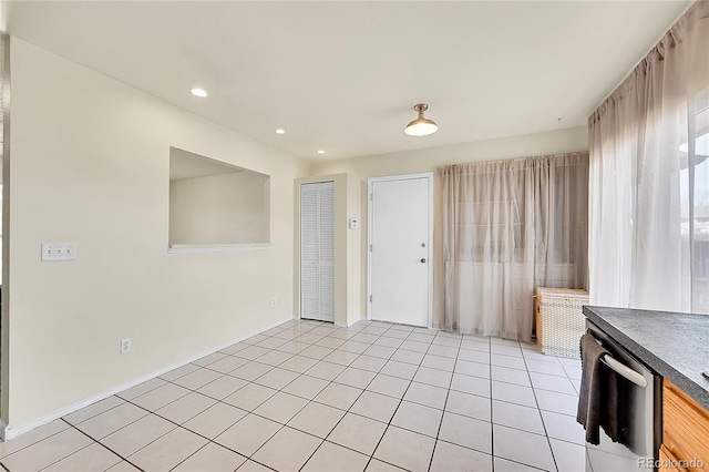 interior space with light tile patterned floors, recessed lighting, and baseboards