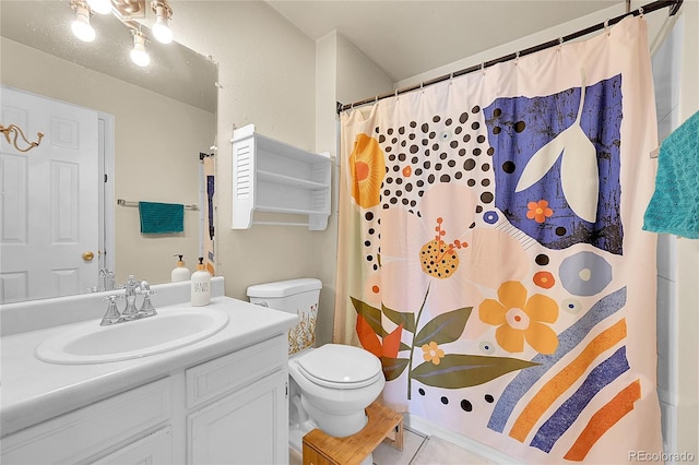 full bathroom with tile patterned floors, curtained shower, toilet, and vanity