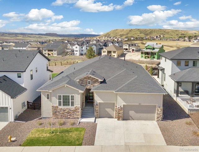 drone / aerial view with a residential view and a mountain view