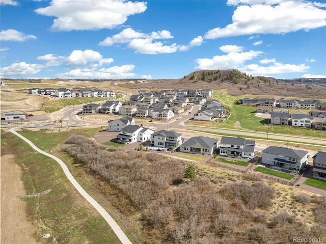 drone / aerial view with a residential view and a mountain view