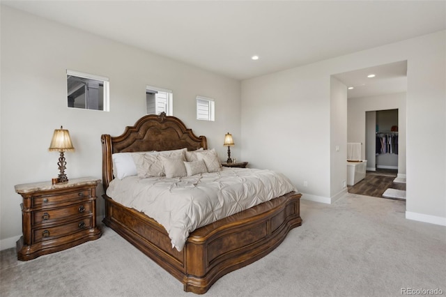 carpeted bedroom featuring recessed lighting and baseboards