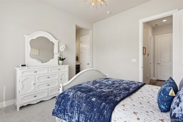 bedroom with baseboards and visible vents