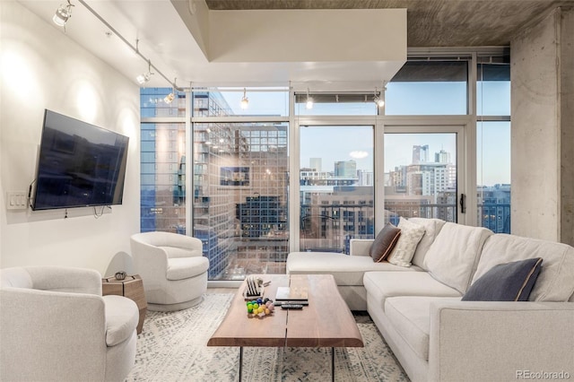 living room featuring expansive windows and track lighting