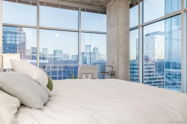 bedroom featuring floor to ceiling windows