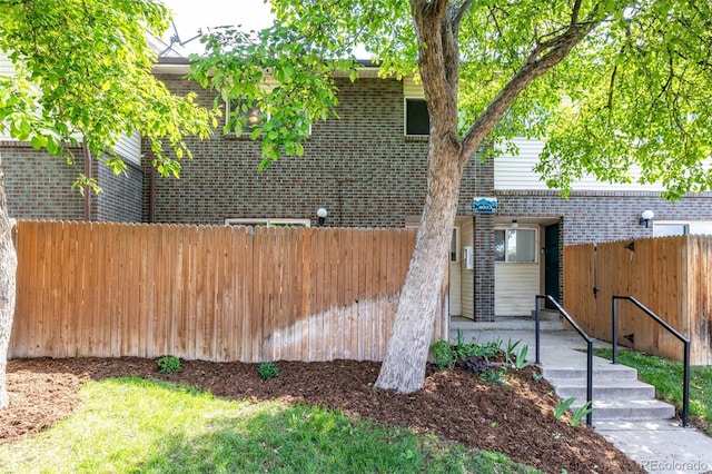 8023 Wolff St Unit C, Westminster, CO 80031 - view of side of home with fence and brick siding
