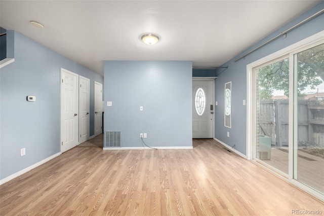 8023 Wolff St Unit C, Westminster, CO 80031 - unfurnished living room featuring light wood finished floors and baseboards