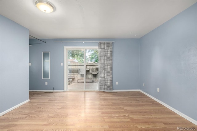 8023 Wolff St Unit C, Westminster, CO 80031 - unfurnished room featuring wood finished floors and baseboards