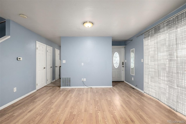 8023 Wolff St Unit C, Westminster, CO 80031 - entrance foyer with light wood-type flooring and baseboards