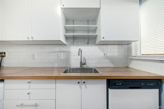 8023 Wolff St Unit C, Westminster, CO 80031 - kitchen featuring dishwasher, a sink, open shelves, white cabinets, and backsplash