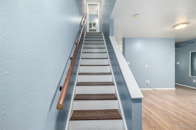 8023 Wolff St Unit C, Westminster, CO 80031 - stairs featuring wood finished floors, baseboards, and a textured wall