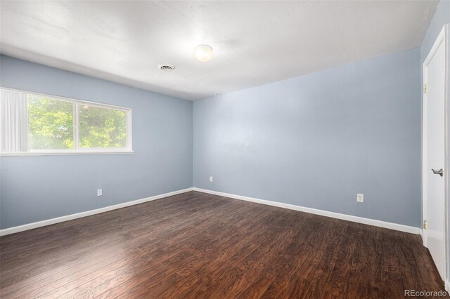8023 Wolff St Unit C, Westminster, CO 80031 - unfurnished room featuring dark wood finished floors and baseboards