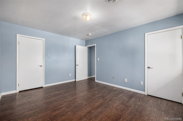 8023 Wolff St Unit C, Westminster, CO 80031 - unfurnished bedroom featuring wood finished floors and baseboards