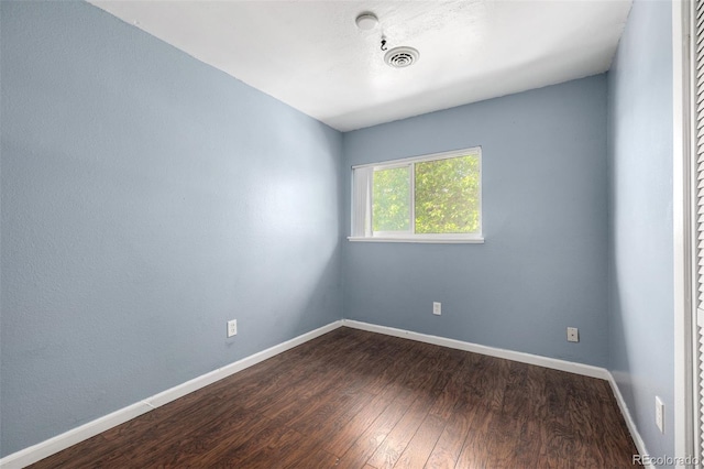 8023 Wolff St Unit C, Westminster, CO 80031 - empty room with dark wood-style flooring and baseboards