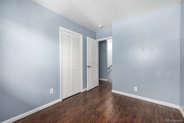 8023 Wolff St Unit C, Westminster, CO 80031 - unfurnished bedroom featuring baseboards, wood finished floors, and a closet