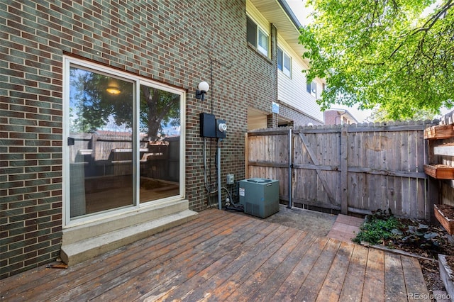 8023 Wolff St Unit C, Westminster, CO 80031 - wooden deck featuring fence, central air condition unit, and entry steps