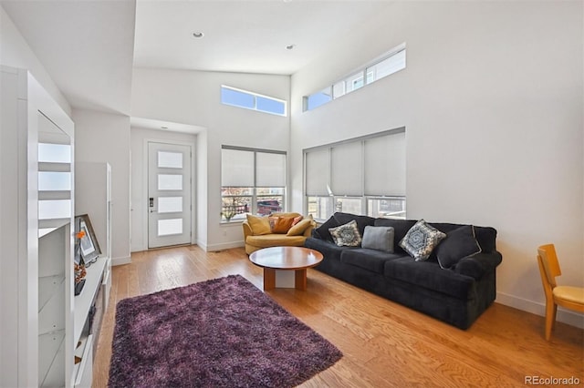 11059 E 25th Dr, Aurora, CO 80010 - living room with wood finished floors and a towering ceiling