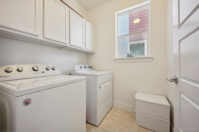 11059 E 25th Dr, Aurora, CO 80010 - laundry room featuring cabinet space, washer and clothes dryer, and light tile patterned floors