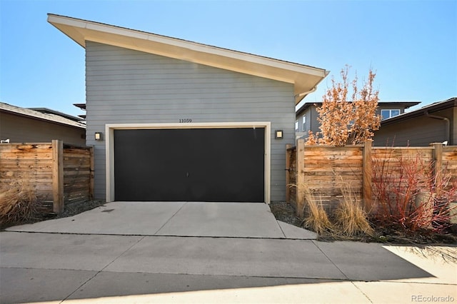 11059 E 25th Dr, Aurora, CO 80010 - view of front of property featuring a garage and concrete driveway