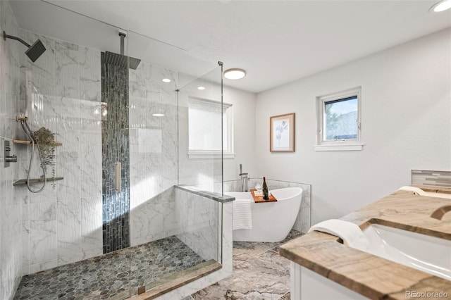 bathroom featuring separate shower and tub and vanity