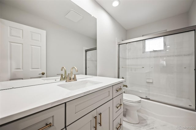 full bathroom featuring vanity, toilet, and enclosed tub / shower combo