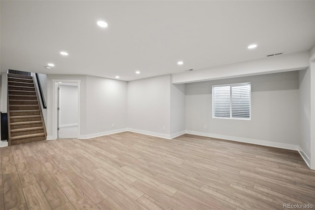 basement featuring light wood-type flooring