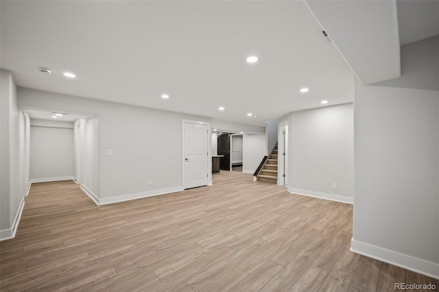 basement featuring light hardwood / wood-style floors