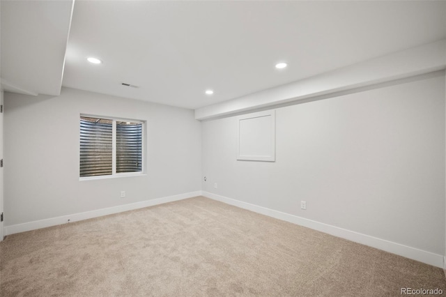 empty room with light colored carpet