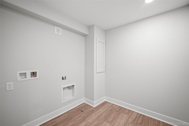 washroom featuring washer hookup and light hardwood / wood-style floors