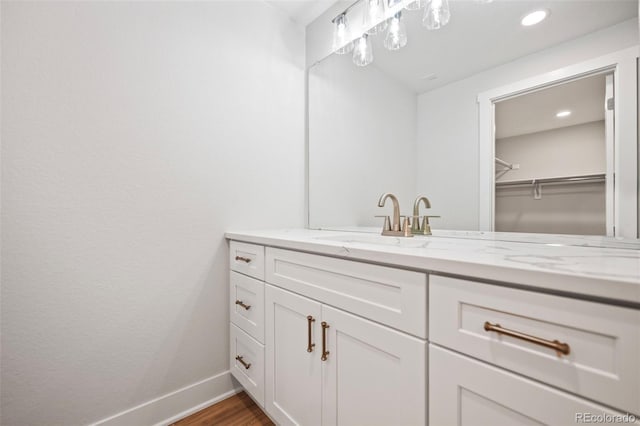 bathroom featuring hardwood / wood-style floors and vanity