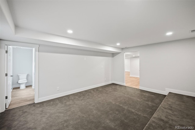 basement with dark carpet