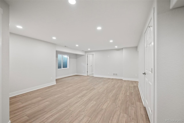 basement featuring light wood-type flooring