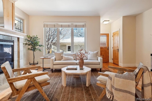 1907 S Columbine St, Denver, CO 80210 - living room featuring a tile fireplace and wood finished floors
