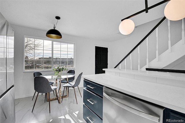 kitchen with decorative light fixtures and stainless steel dishwasher