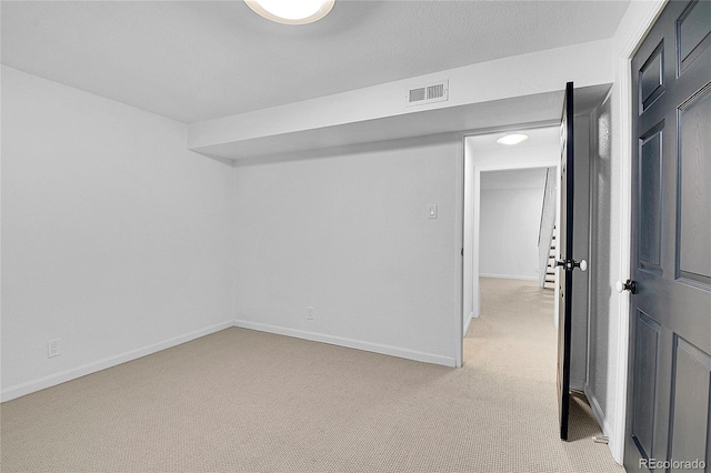 basement with light colored carpet