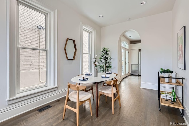 dining area featuring dark hardwood / wood-style floors